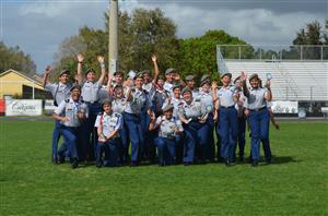 Image of JROTC students holding a trophy Image of JROTC students holding a trophy
